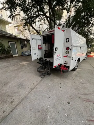 Magnet Plumbing service vehicle on-site for Grease Trap Cleaning in Delray